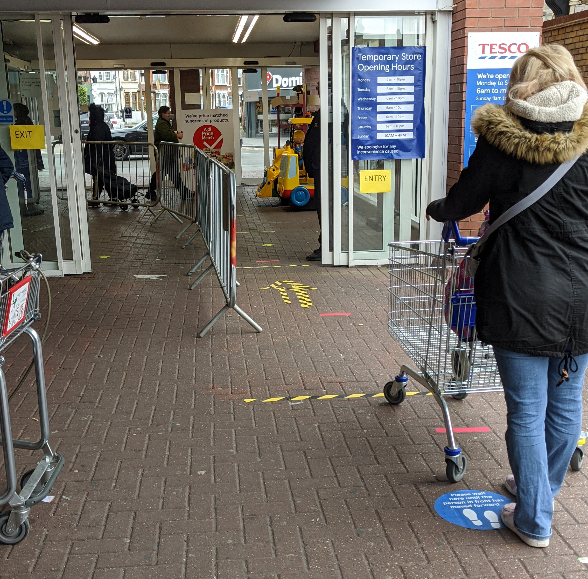 Queue at Tesco's observing 2m social distancing